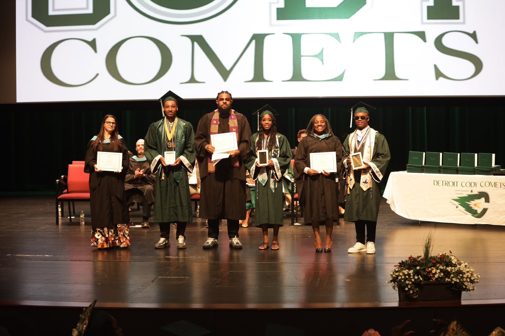 Scholars and staff recognized on stage