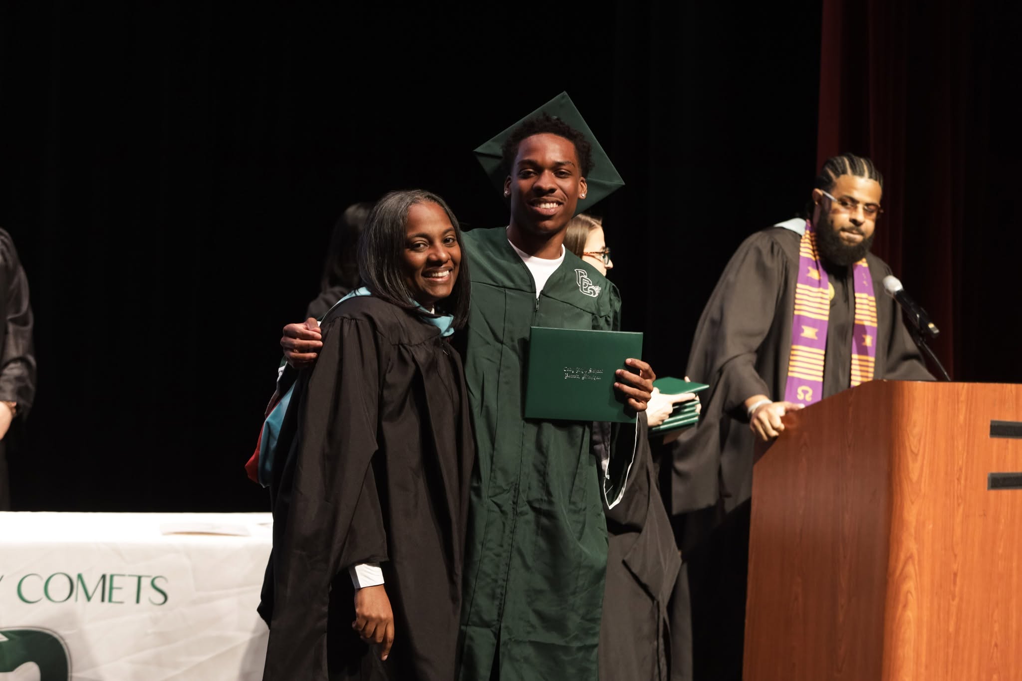 Diploma in hand — a Comet crosses the stage